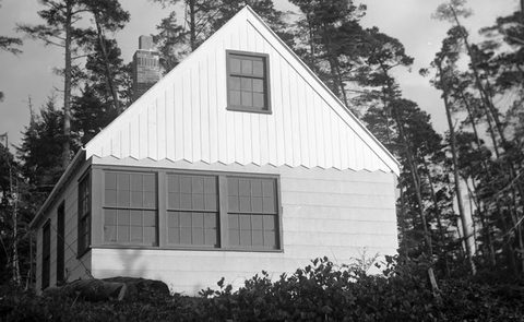 The finished cabin with asbestos siding.