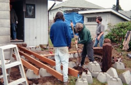 Here you see Nancy working with a shovel to level a support block. Bill has arrived in the background.