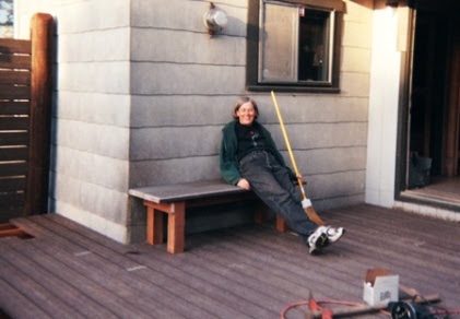 All done! Nancy relaxes on a bench built from scrap lumber and decking.