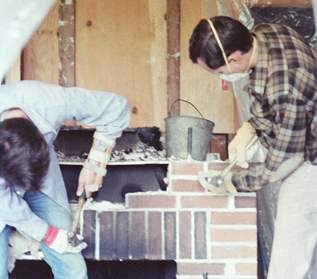 Image 5: Dave and Steve battle with removing the main fireplace. This wasn't easy as the mortar was quite strong.