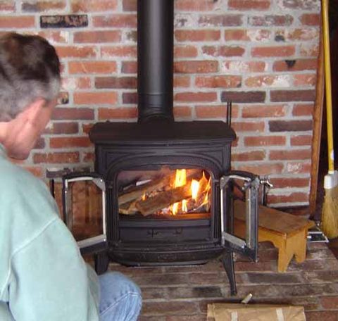 In this picture Gary and Steve are installing the stove pipe. Although the Intrepid is smaller in all dimensions, the legs are longer so that the upper...