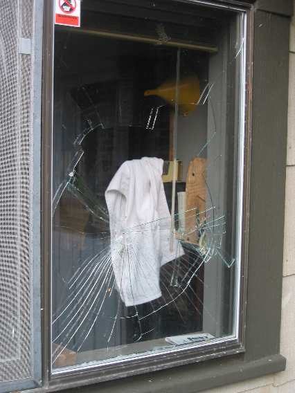 The kitchen window took a real hit. Fortunately, only the outer pane of the double-pane window broke so we removed the glass shards called the "repair" good enough.