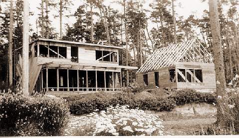 Photo 8: Jewell Lantz obviously built his home quickly: Its framing is nearly done, and the Sullishak cabin hasn't changed much Photos 6 and 7.