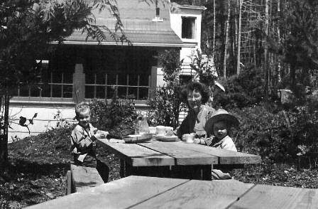 Photo 17: Elsie, Steve and Nancy at picnic tables just south of the cabin.