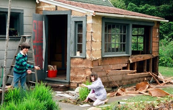 Photo 26: Joel and Gail help tear down the rotten side porch.