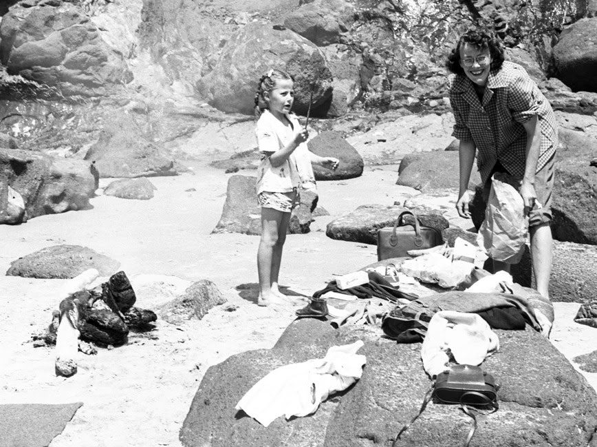 Photo 29: Elsie and Nancy roasting hot dogs at the beach in the early 1950s.