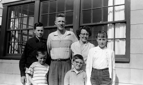 The Sullivan family at the Sullishak cabin, back when it had wood windows from Camp Adair.
