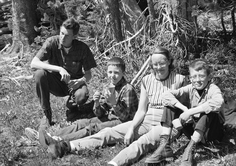 The family hiked a lot ... here Steve, Bill, Elsie and Dave rest beside a trail.