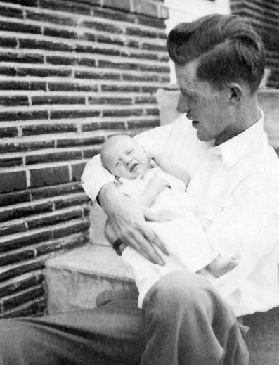 The back of this photo says: 4 weeks old. First visit to Portland. The sun was so bright Steve wouldn't open his eyes.