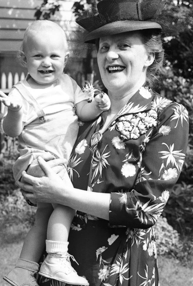 Steve being held by his grandmother, Orma.