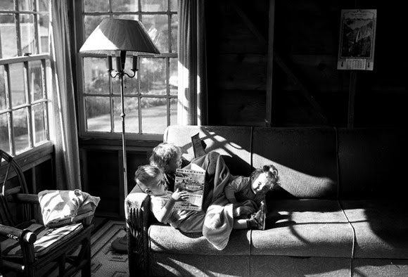 Steve, Nancy, and yet another kid on the couch in the corner of the Sullivan beach cabin.