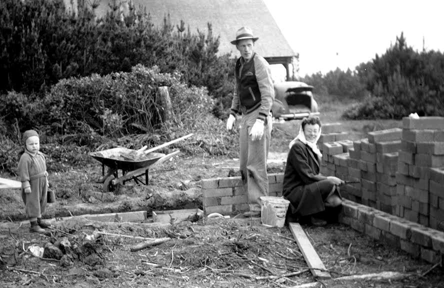 Wes, Elsie and Steve lay the foundation blocks for Sullishak. Nancy is in the car's back seat. Wes and Elsie are mixing the mortar by hand.