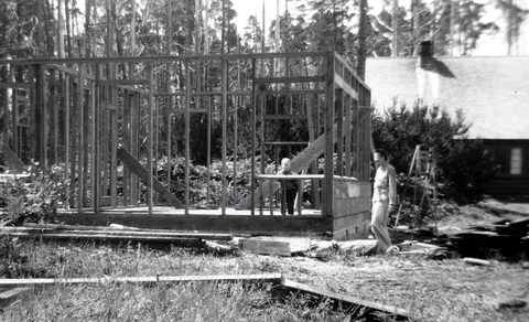 Elsie watches Steve in what would become Sullishak’s living room, with the log cabin in the background.