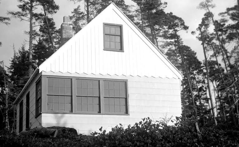 The finished cabin with asbestos siding.