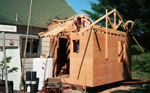 Dave and Bill Sullivan install rafters for the replacement porch.