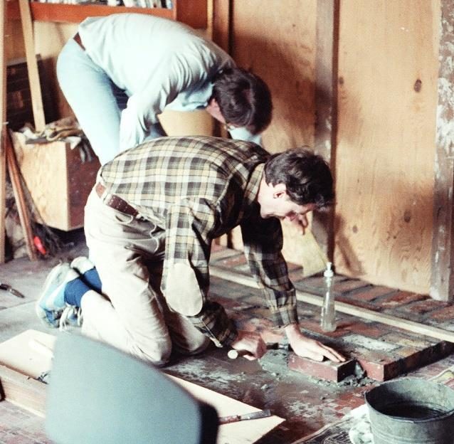 Dave and Steve begin laying bricks for the wood stove.