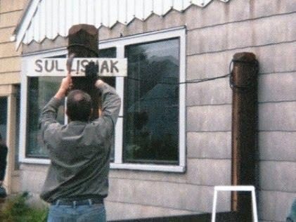 Right: The Sullishak sign gets moved from the flag pole (seen in a photo above) to the new wind screen pole.