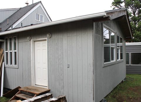 This view of the back of the cabin is where a storage shed has been replaced by a new family room. The foundation for the addition was started in 2013. The exterior is now finished.